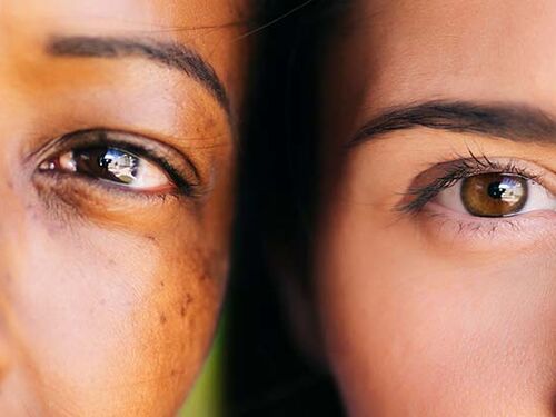 close up shot of the face of a man and woman