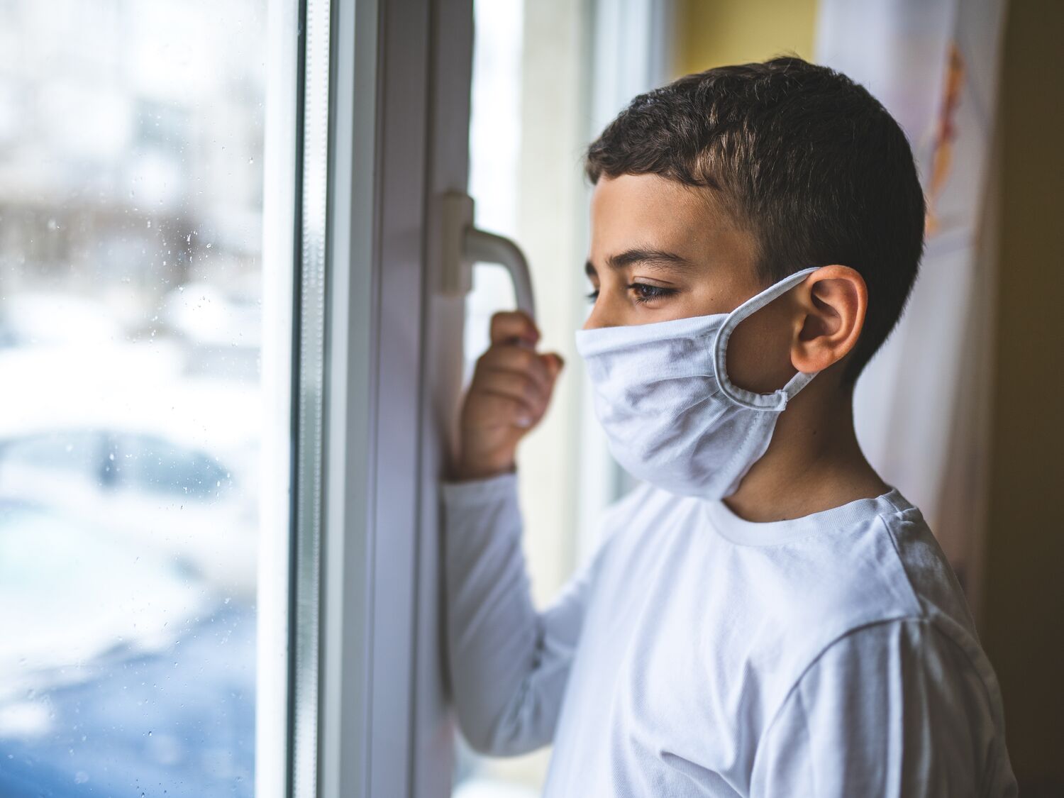 Boy wearing anti virus mask staying at home
