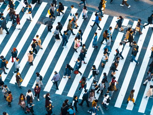 People walking at Shibuya crossing in Tokyo.