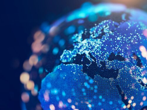 A dotted earth with lights bokeh on a dark blue background.  (City Lights 2012 - Flat map - https://images.nasa.gov/details-GSFC_20171208_Archive_e001589 - Softwar:3dsMax, Adobe After Effects, and Photoshop)