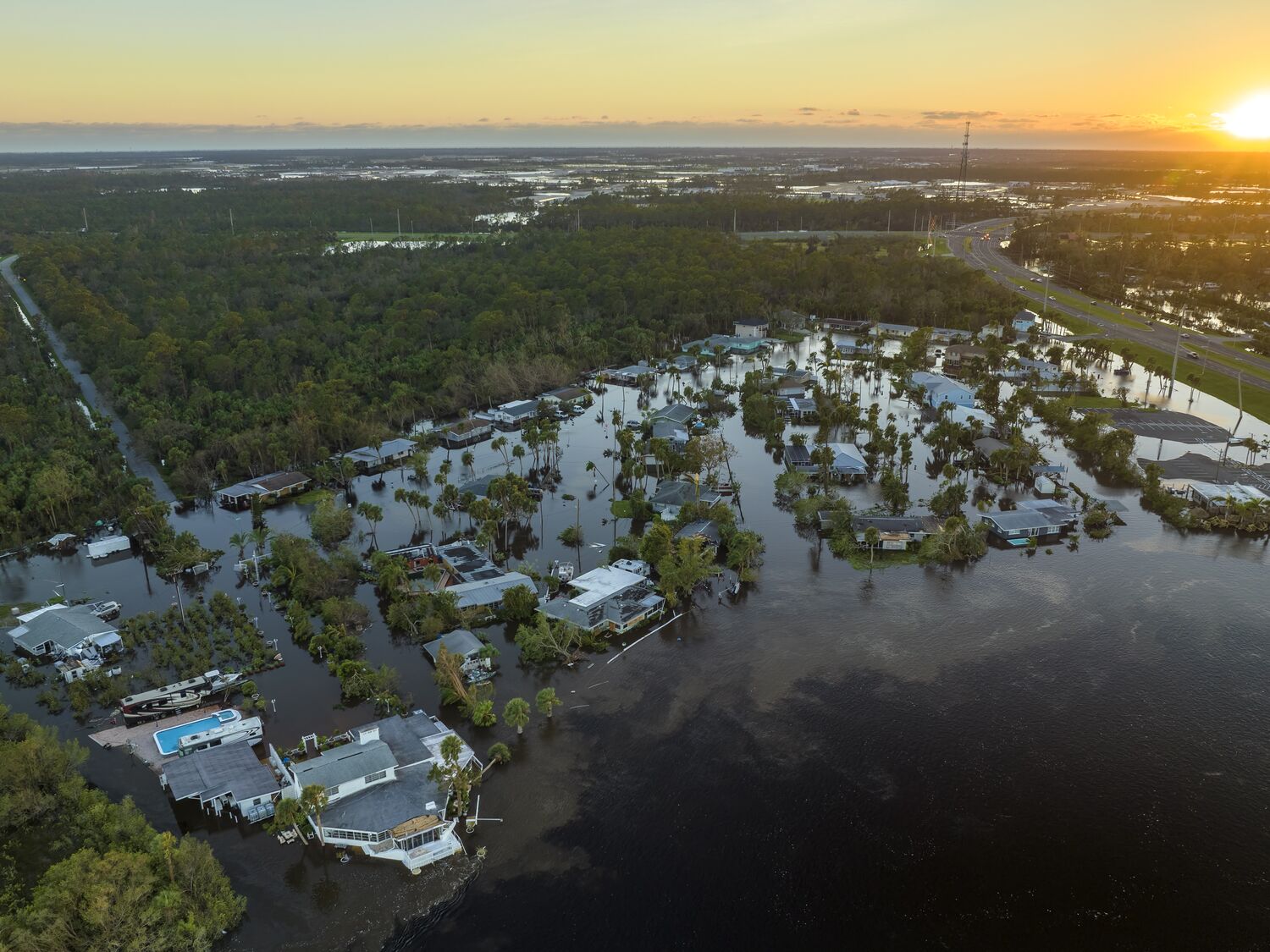 Surrounded by hurricane Ian rainfall flood waters homes in Florida residential area. Aftermath of natural disaster