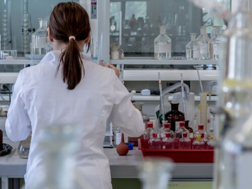 Back of a scientist in a lab.