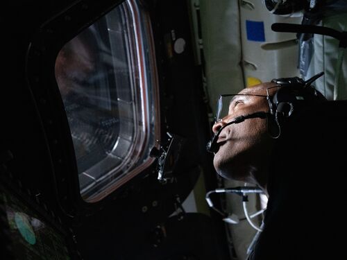 NASA astronaut and Artemis II Pilot Victor Glover pictured here in the Orion spacecraft during the Artemis II lunar flyby. Glover and his fellow crewmates spent approximately seven hours taking turns at the Orion windows capturing science data to share with their team back on Earth. At closest approach, they came within 4,067 miles of the Moon’s surface.