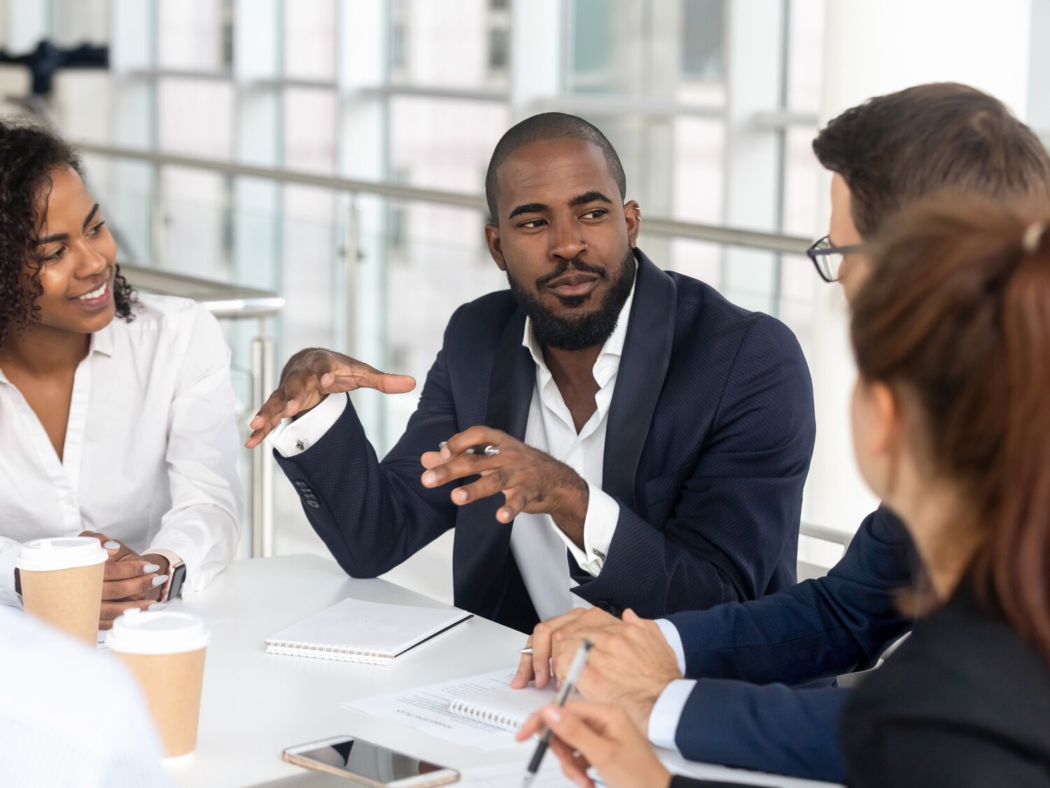 Employees sitting and talking to each other.