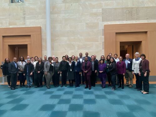 Members and staff of the Tech Action Collaborative at a meeting in December 2023.