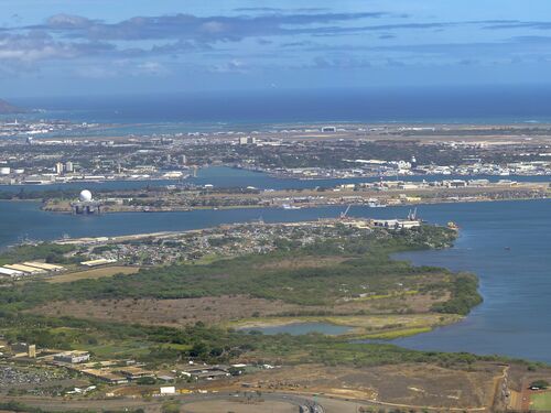 Aerial view of Pearl Harbor and Honolulu, Oahu, Hawaii, USA. From front to back - Pearl City Penninsula, (front right) Middle Loch with remnants of WWII mothball fleet, Ford Island, Joint Base Pearl Harbor-Hickam, Honolulu International Airport with Hickam Field to right, Honolulu, and Diamond Head. Photographed August 9, 2012, by 2018 the mothball fleet was gone.