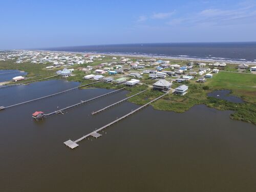 Drone aerial image of houses on a barrier island in Louisiana