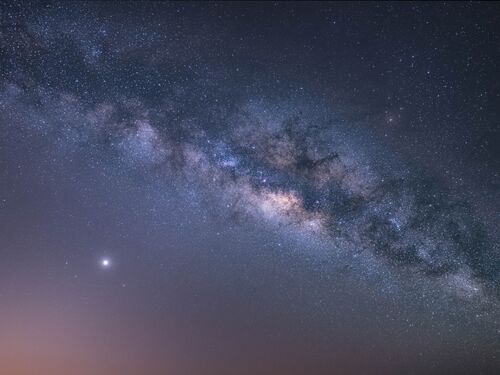 View universe space shot of milky way galaxy with stars on a night sky background. The Milky Way is the galaxy that contains our Solar System.