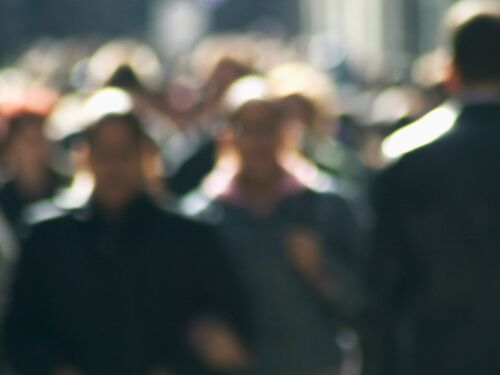Out of focus image of a street crowd