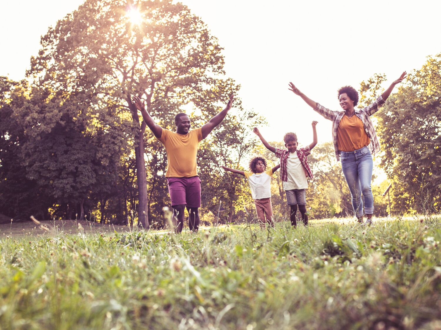 African American family having fun outdoors.