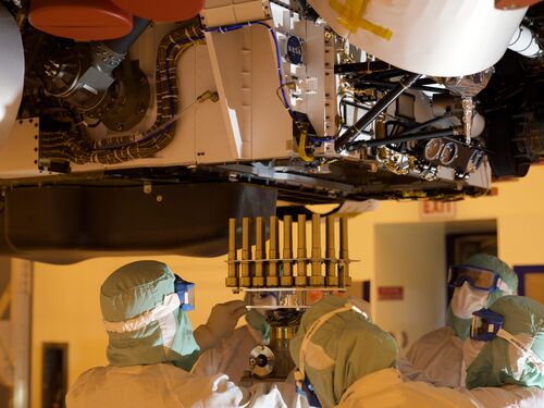 A tray holding 39 sample tubes headed to Mars is installed into the Perseverance rover on May 21, 2020, in a clean room at NASA's Kennedy Space Center in Florida during final installation for launch.