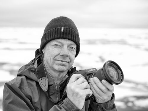 Christopher Michel holding his camera.