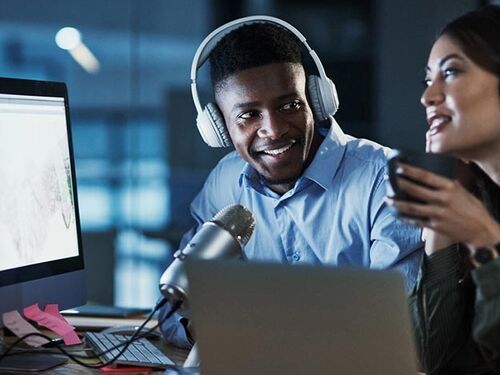 Two people hosting a podcast.