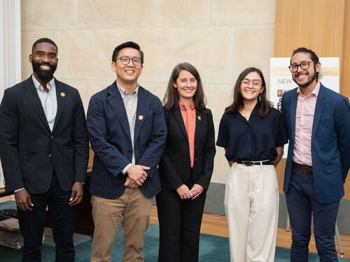Group of New Voices members smiling at the camera.
