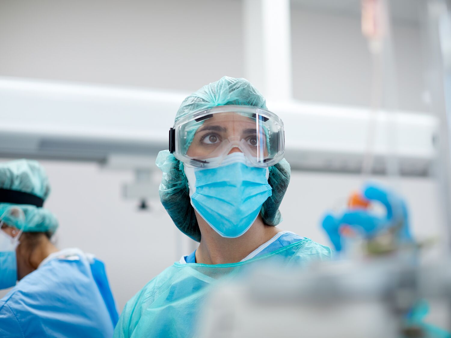 Healthcare worker wearing protective mask and glasses in a  Hospital COVID ward.