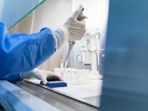 Scientists conduct scientific experiments in the biosafety cabinet of the laboratory .