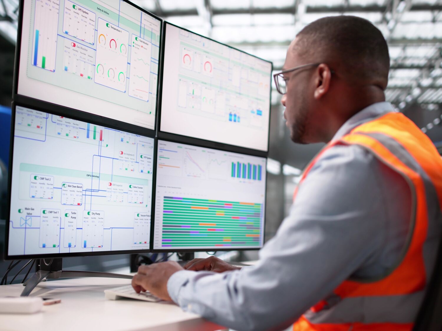 Black American Engineer Monitors Gas Turbine.