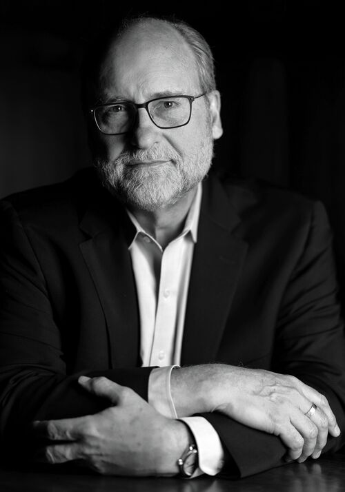 Headshot of David May, Chief Communications Officer. Photo taken at the National Academy of Sciences Building in Washington, D.C.
