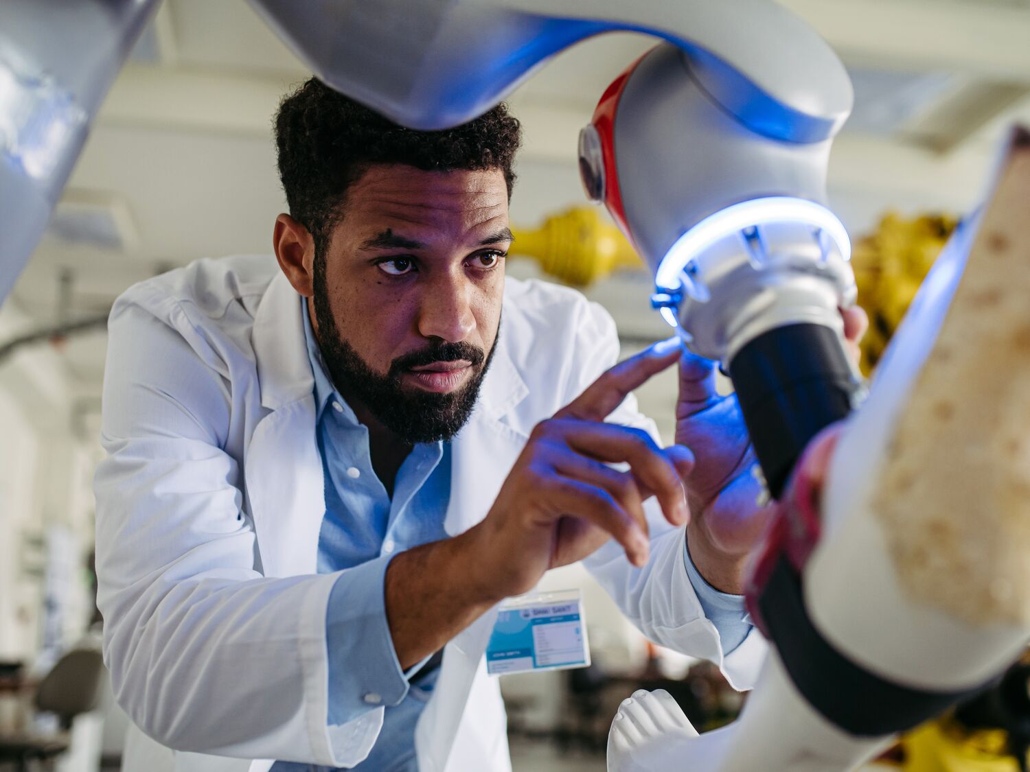 Robotic engineer working on robotic knee replacement surgery project. Concept of robotics, engineering and computer science in healthcare.