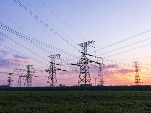 Pylons, high voltage pylons in the evening.