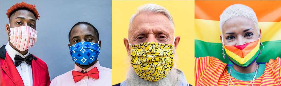 Three portraits of people wearing colorful face masks: two men in bow ties and patterned masks, an older man with a yellow banana-print mask, and a woman with a rainbow Pride mask in front of a Pride flag.