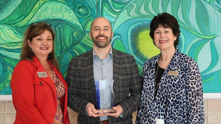 GRP Senior Program Manager Dan Burger accepting the Gulf Star Partnership Award on behalf of the GRP.