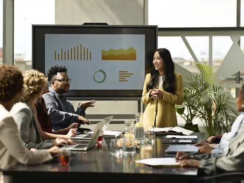 A group of people sharing ideas during a meeting.
