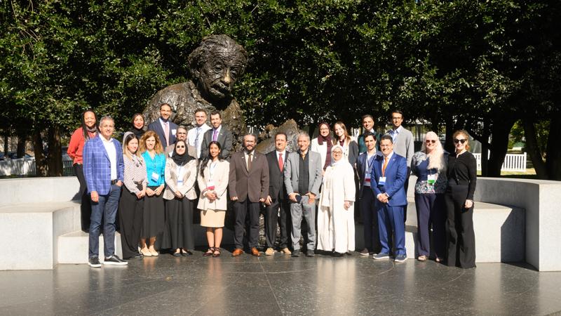 NASEM-KFAS Several workshop attendees posing at the Albert Einstein Memorial outside NAS building