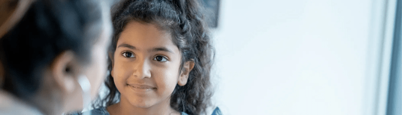 Doctor Listening to a Young Girls Heart