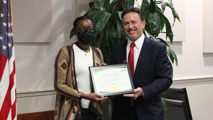 Simone receiving an award